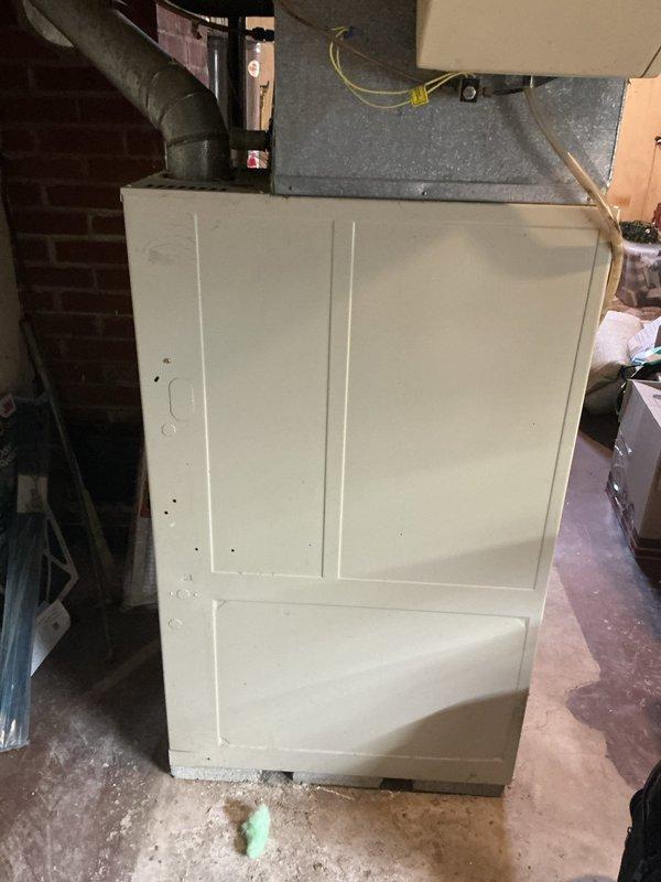 Conducted on-site evaluation of non-functional air conditioning system in residential basement that has been inoperative for approximately two years. Assessed existing HVAC equipment including air handler unit with connected plenum and ductwork distribution system. Documented current system configuration and conditions to provide replacement estimate for new AC unit installation in preparation for property sale.