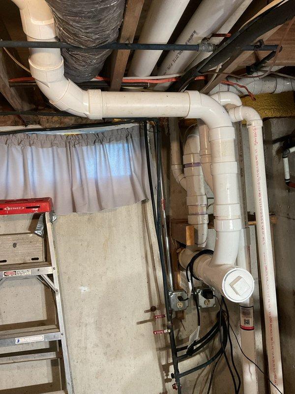 Completed follow-up visit to continue plumbing work from previous service call. Installed additional white PVC waste piping throughout basement utility area, including multiple elbow joints, connections, and fittings to extend the existing drainage system. Performed system flushing to verify proper flow and ensure all new connections were sealed and functioning correctly.