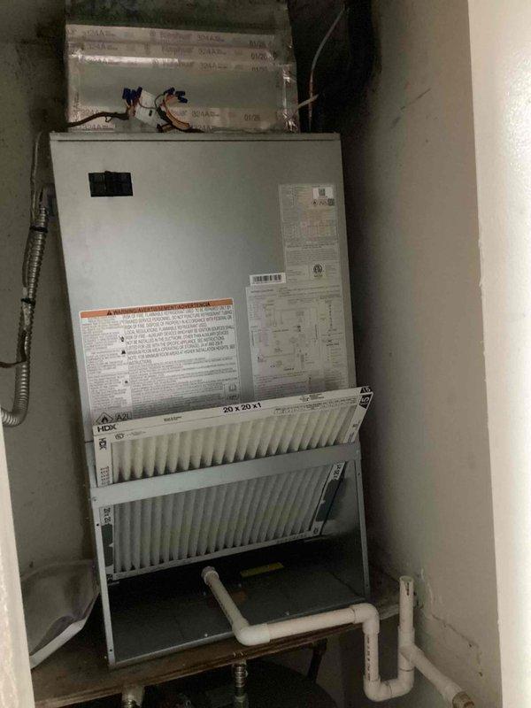 Successfully installed a complete Carrier heat pump system consisting of a 2.0-ton R454B refrigerant wall-mount air handler equipped with 8kW electric heating elements and a 1.5-ton R454B refrigerant 15 SEER outdoor heat pump unit. Reconnected the air handler to existing supply air ductwork in the mechanical closet, ensuring proper airflow distribution. Reconnected system to existing refrigerant line set, performed complete line flush to remove contaminants, and conducted comprehensive pressure testing to verify system integrity and leak-free operation. Reconnected both high and low voltage electrical wiring to the new equipment, ensuring proper power supply and control circuit functionality. Installed a Honeywell T-6 digital programmable thermostat to provide efficient temperature control and system operation. Applied proper identification labels to the outdoor heat pump unit per installation standards. All work performed in accordance with manufacturer specifications and local buildi