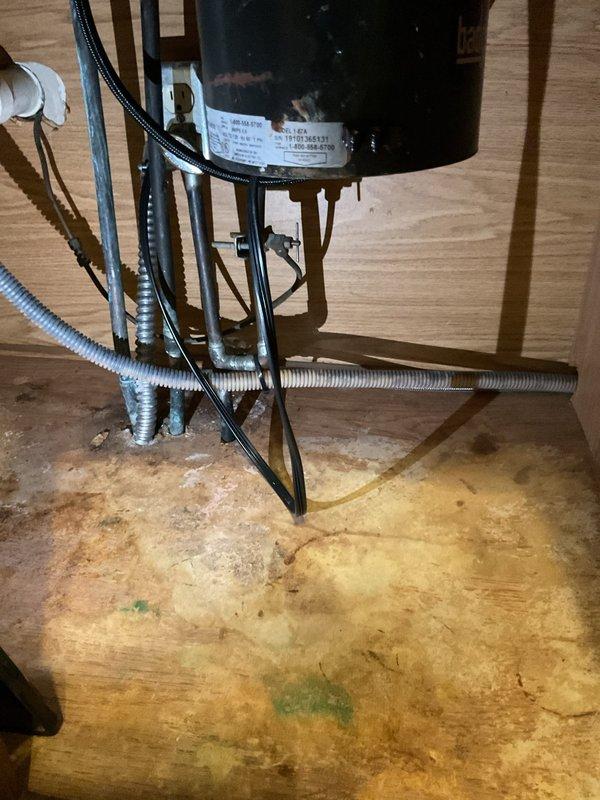 Installed customer-supplied kitchen faucet in double-basin stainless steel sink, replacing existing fixture with new chrome dual-handle faucet and spray nozzle assembly. Verified proper water supply connections, tested for leaks, and confirmed full operational functionality of both hot and cold water lines and spray attachment.