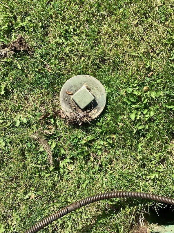 Responded to service call for downstairs toilet blockage. Upon arrival, accessed exterior cleanout to snake main drain line servicing the affected fixture. Cleared obstruction using power auger equipment through ground-level access point, restoring proper drainage flow to the toilet. Verified successful clearance and proper operation upon completion.
