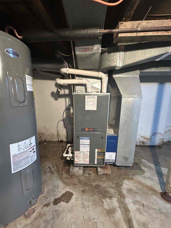 Conducted on-site assessment for air conditioning system installation at residential property. Evaluated existing HVAC infrastructure in basement, including previously installed Trane furnace and existing ductwork system. Confirmed electrical panel capacity and available breaker slots to accommodate new AC unit requirements. Assessed refrigerant line routing path and condensate drain configuration for outdoor condenser connection. Documented current equipment specifications and spatial layout to provide comprehensive replacement estimate for complete AC system installation.
