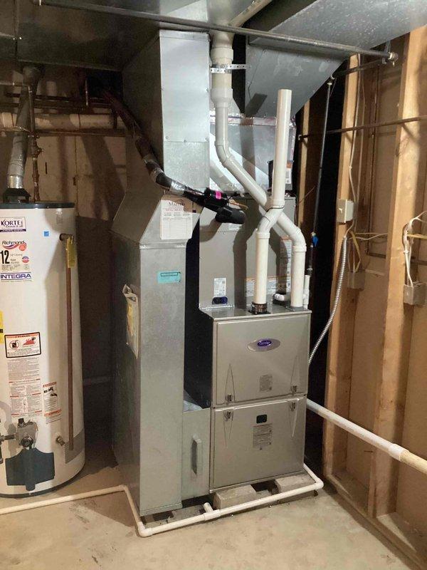 Completed full HVAC system replacement including installation of Carrier Infinity Series variable-speed air conditioner model 26VNA148W003, Carrier 59MN7C100C21-22 modulating gas furnace with up to 98% AFUE rating, Carrier CVAVA4821XMA evaporator coil, and Carrier SYSTXCCITC01-C Infinity System Controller with WiFi capability. Removed and recycled existing equipment, reconnected all supply and return ductwork to new system, installed new 2-inch PVC condenser pad with pea gravel base for outdoor unit stability, registered all equipment warranties, programmed communicating thermostat and provided operational explanation to ensure proper system functionality.