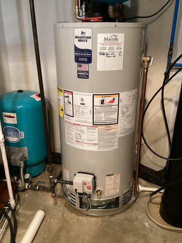 Responded to emergency call for leaking 50-gallon natural gas power vent water heater in basement. Removed and disposed of failed Bradford White unit that had been previously evaluated by other contractors. Installed new 50-gallon natural gas power vent Bradford White water heater with proper venting configuration. Connected all copper supply lines, gas line with appropriate shutoff valve, and installed condensate drain with PVC piping. Verified proper operation of power vent motor and gas control valve. Tested system for leaks, confirmed proper temperature and pressure relief valve operation, and ensured all connections met code requirements. System operational and customer notified upon completion.