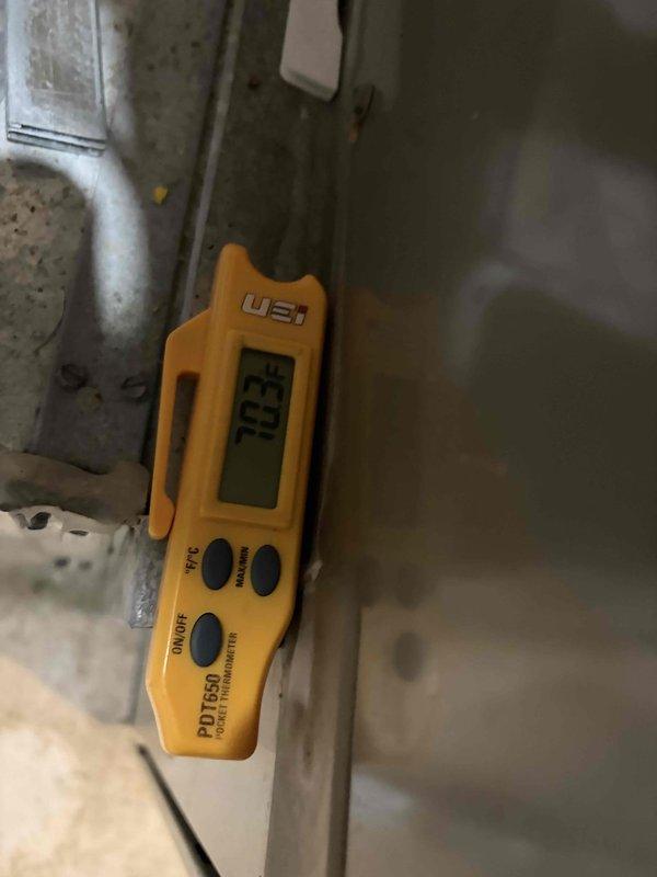 Responded to no cooling complaint on residential AC system. Upon arrival, found unit attempting to start but failing to operate. Performed diagnostic evaluation of system components including temperature measurements at supply register showing 70.2°F, confirming lack of cooling. Inspected indoor air handler, furnace, and associated refrigerant lines with gauges attached. Identified issue preventing compressor operation and restored system to proper cooling function.