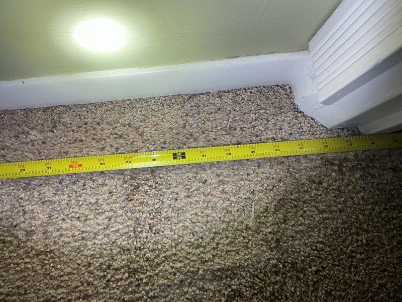 Conducted on-site assessment for mini split installation in residential property currently without air conditioning. Evaluated interior bedroom space with dual closets and measured dimensions for proper equipment sizing and placement. Documented existing conditions and spatial requirements to develop comprehensive installation estimate for ductless mini split system.