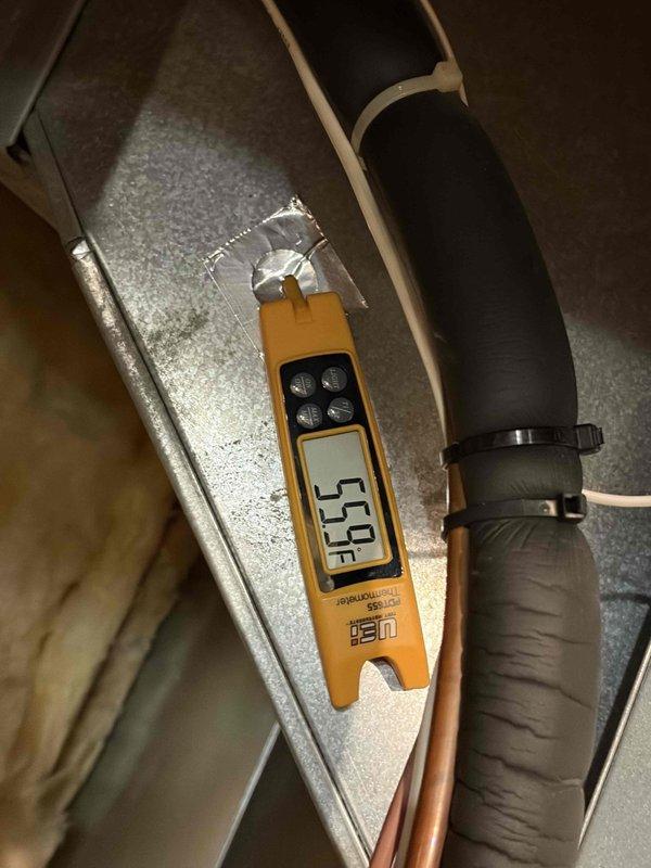 Completed prepaid preventive maintenance cooling system inspection on residential air conditioning unit. Performed comprehensive system evaluation including supply air temperature verification at 55°F, refrigerant line inspection, and outdoor condensing unit service check with manifold gauge set attached to measure system pressures and assess refrigerant charge levels. All components found operating within normal parameters with no deficiencies noted.