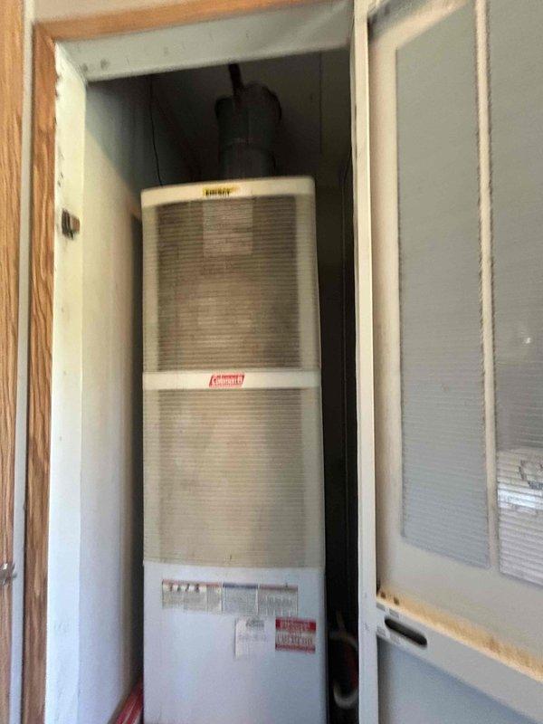 Conducted comprehensive site evaluation for complete HVAC system replacement following previous service visit. Assessed existing Coleman furnace/air handler unit installed in interior utility closet, documenting current equipment specifications and configuration. Evaluated outdoor condensing unit location and surrounding conditions, noting significant debris accumulation, moisture-related algae growth on foundation, and weathered ventilation components requiring attention during replacement. Prepared detailed replacement estimate including equipment specifications, installation requirements, and necessary site preparation recommendations to ensure proper system performance and longevity.