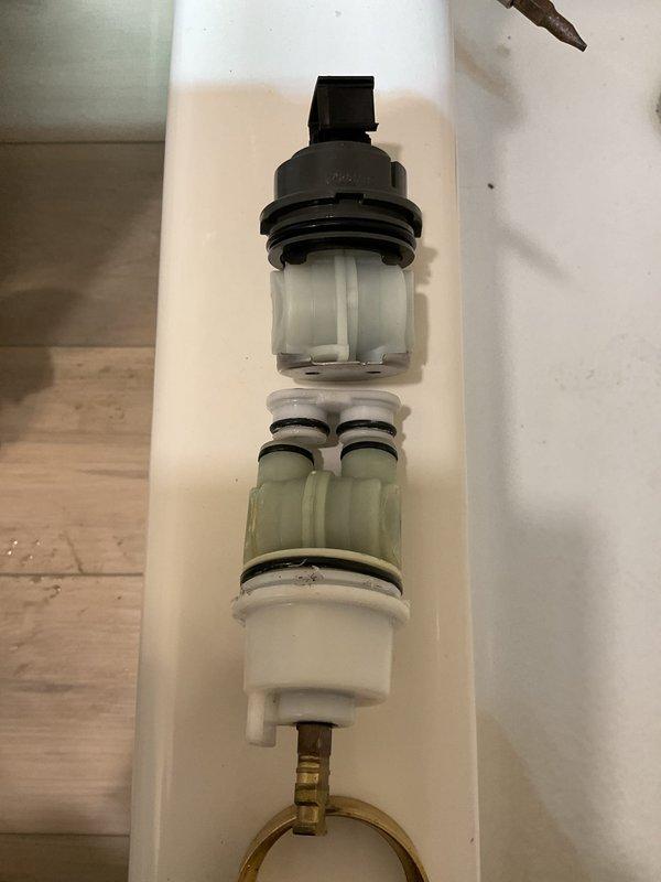 Installed shower trim assembly on existing shower valve. Disassembled and inspected valve cartridge components to ensure proper operation, including cartridge housing, O-rings, and supply line connections, then completed trim installation with all components functioning correctly.