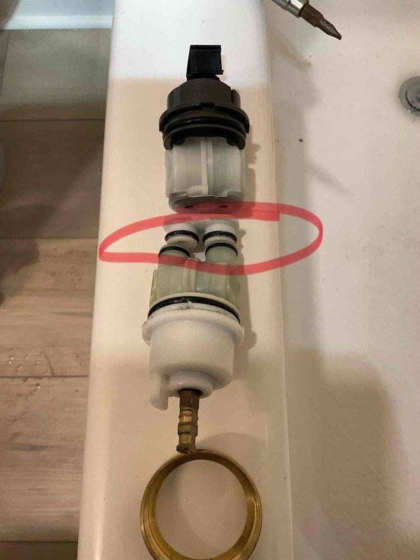 Installed shower trim assembly on existing shower valve. Disassembled and inspected valve cartridge components to ensure proper operation, including cartridge housing, O-rings, and supply line connections, then completed trim installation with all components functioning correctly.