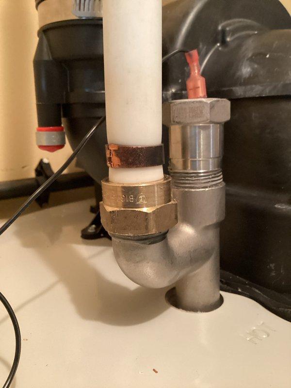 Responded to service call regarding sulfur odor from recently installed water heater. Upon inspection, identified issue related to anode rod reaction with water chemistry causing characteristic sulfur smell. Examined plumbing connections and supply lines for any contributing factors, noting corrosion and mineral deposits on existing piping components. Documented current installation configuration including PVC supply lines and brass fittings. Advised customer on odor mitigation options including anode rod replacement with aluminum/zinc alloy rod or powered anode system to eliminate sulfur-reducing bacteria interaction.