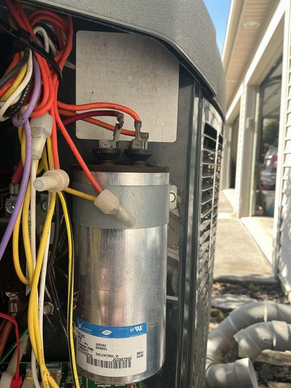 Responded to no cooling call on aging HVAC system where outdoor unit failed to operate when thermostat called for cooling. Upon arrival, performed diagnostic inspection of outdoor condensing unit and found failed dual run capacitor preventing compressor and condenser fan motor from starting. Removed access panel, tested capacitor with multimeter confirming complete failure with zero microfarad reading. Replaced defective capacitor with properly rated OEM equivalent, verified all electrical connections secure, and restored power to system. Tested unit through complete cooling cycle, confirmed compressor and outdoor fan motor operating properly with normal amp draw, and verified adequate airflow and temperature split across evaporator coil. System restored to full operational status.