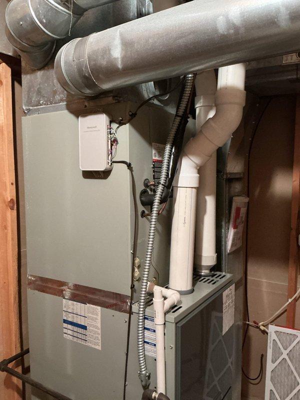 Conducted comprehensive assessment of existing residential HVAC system to provide equipment replacement estimate. Evaluated current furnace and air handler configuration in basement mechanical room, documenting existing ductwork infrastructure, electrical connections, refrigerant line routing, and condensate drainage system. Photographed equipment specifications, manufacturer labels, and overall installation layout to determine proper sizing and compatibility requirements for new system components.