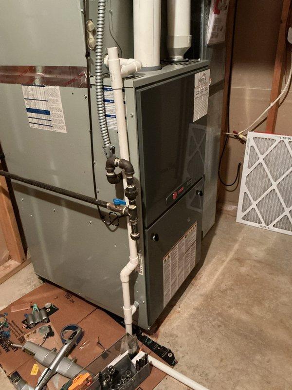 Conducted comprehensive assessment of existing residential HVAC system to provide equipment replacement estimate. Evaluated current furnace and air handler configuration in basement mechanical room, documenting existing ductwork infrastructure, electrical connections, refrigerant line routing, and condensate drainage system. Photographed equipment specifications, manufacturer labels, and overall installation layout to determine proper sizing and compatibility requirements for new system components.