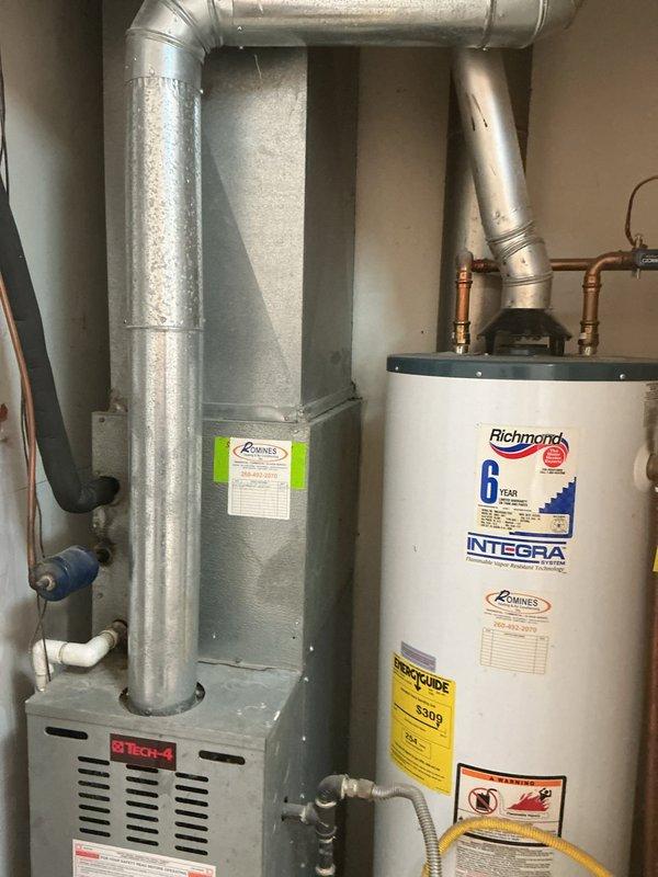 Conducted comprehensive evaluation of existing 30+ year old gas furnace and air conditioning system for replacement estimate. Assessed current equipment condition, measured existing furnace dimensions and clearances in mechanical room, documented installation configuration including ductwork connections and utilities. Photographed aging HVAC equipment to support replacement recommendations and verify proper sizing requirements for new system installation.