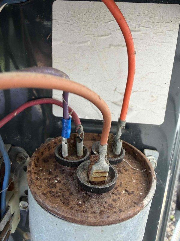 Completed seasonal cooling maintenance on residential HVAC system. Performed standard inspection of outdoor condensing unit, checked electrical connections and capacitor which showed signs of rust and corrosion on housing but remained operational. Noted capacitor condition for future monitoring and advised customer this was their final prepaid maintenance visit, with recommendation to renew membership for continued service coverage.
