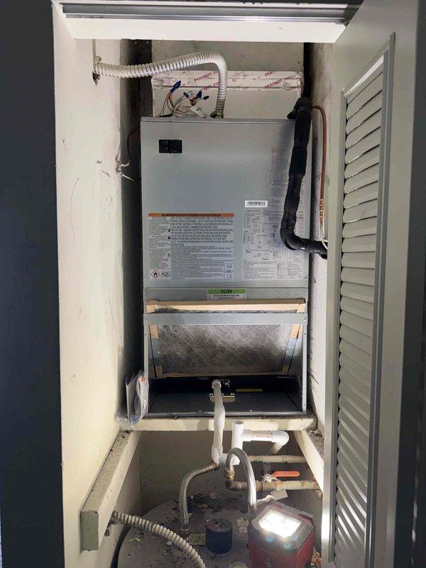 Completed installation of Carrier 1.5-ton, 15 SEER heat pump system with R454B refrigerant and Carrier 2.0-ton wall mount air handler equipped with 8kW electric heat strips. Reconnected unit to existing supply air ductwork and refrigerant line set, performed complete flush and pressure test to verify system integrity. Installed Honeywell T-6 digital thermostat and reconnected all existing high and low voltage wiring. Applied manufacturer identification labels to outdoor heat pump unit and verified all connections meet code requirements.