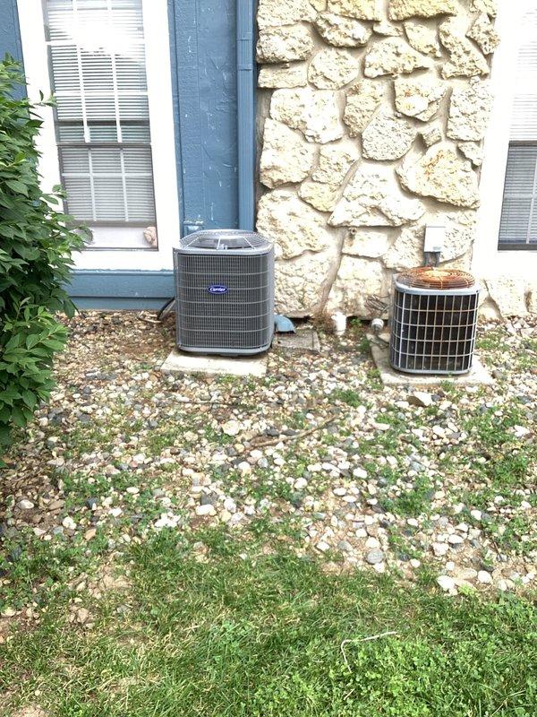 # HVAC System Installation

Successfully installed customer-supplied air handler and outdoor condensing unit at residential property. The new Carrier air conditioning system was positioned on gravel pad against exterior stone wall, with proper clearances maintained for service access and airflow. Indoor air handler with evaporator coil was installed in end closet location, featuring vertical configuration with refrigerant lines properly secured and insulated. All electrical connections, condensate drainage, and PVC piping were completed to manufacturer specifications. System startup performed with refrigerant lines pressure tested and equipment operational.