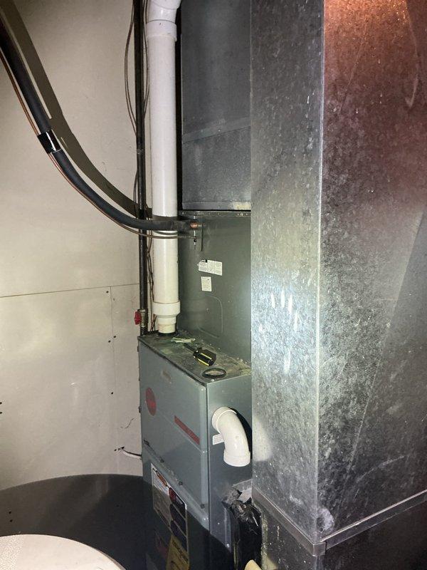 Completed on-site evaluation for 3.5 ton air conditioning system replacement. Assessed existing HVAC equipment including furnace unit and associated condensate drainage system, documented current installation measurements and configuration. Provided comprehensive estimate for complete air conditioner replacement including equipment specifications and installation requirements.