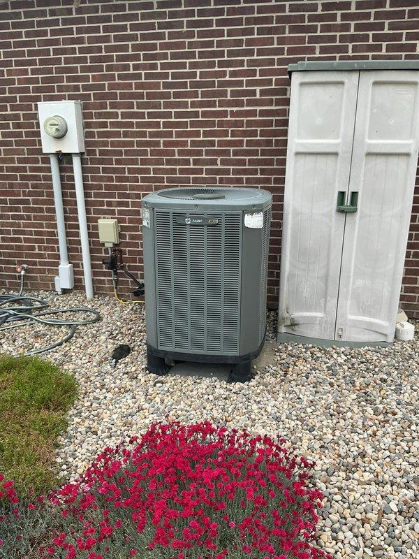Conducted comprehensive site assessment for complete HVAC system replacement including furnace, air conditioning unit, and water heater. Primary concern identified with existing furnace requiring immediate replacement. Evaluated outdoor cylindrical heat pump/AC unit installation against brick exterior, documented electrical conduit routing and disconnect box configuration. Inspected Bradford White 40-gallon LP gas water heater (Model M1A0T6FCX) and verified current system specifications including 36,000 BTU/hr input rating. Photographed existing equipment layout, utility access points, and electrical infrastructure to prepare detailed replacement estimate for complete system upgrade.