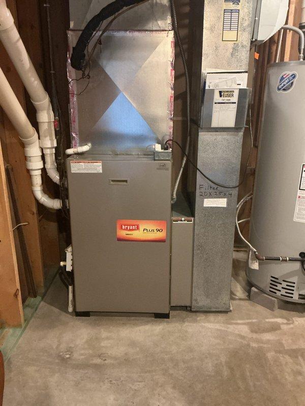 Conducted on-site assessment of existing HVAC system to provide replacement estimates for a Bryant Plus 90 furnace and optional air conditioning unit. Documented current equipment configuration including furnace, air handler, and associated ductwork in basement utility area. Photographed existing installation showing PVC condensate drainage, plenum connections, and filter specifications (20X25X4) to develop accurate replacement proposals for both furnace-only and complete system replacement options.