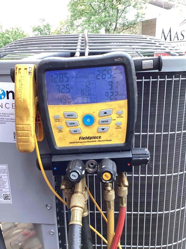 Completed installation of new Carrier air conditioning condenser unit and air handler in side closet location. Unit was positioned on gravel pad against brick exterior wall with proper clearances maintained. Connected refrigerant lines, electrical disconnect, and condensate drainage per manufacturer specifications. Charged system with refrigerant and verified proper operating pressures and temperatures across all zones using digital manifold gauges. Conducted full system startup and performance testing to confirm cooling capacity and airflow meet design specifications.