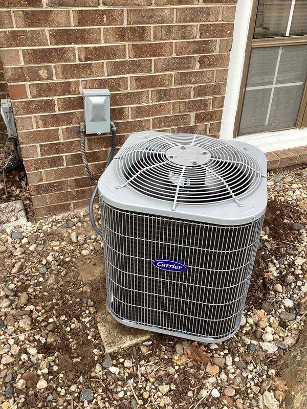 Completed installation of new Carrier air conditioning condenser unit and air handler in side closet location. Unit was positioned on gravel pad against brick exterior wall with proper clearances maintained. Connected refrigerant lines, electrical disconnect, and condensate drainage per manufacturer specifications. Charged system with refrigerant and verified proper operating pressures and temperatures across all zones using digital manifold gauges. Conducted full system startup and performance testing to confirm cooling capacity and airflow meet design specifications.