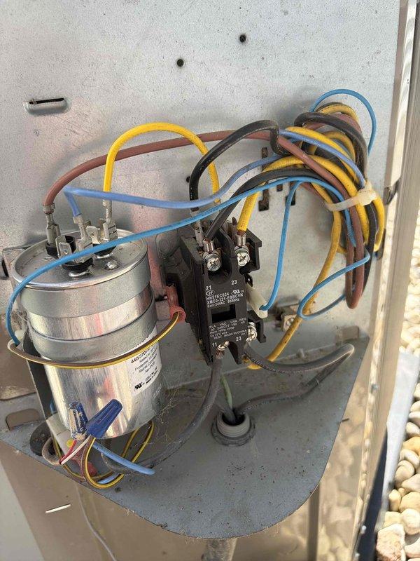 Completed comprehensive AC tune-up on residential split system. Performed visual inspection of indoor furnace unit and outdoor condensing unit, verifying proper installation and component condition. Inspected electrical connections at outdoor disconnect panel, including capacitor and contactor assembly with associated wiring terminations. All components found operating within normal parameters, system ready for cooling season.
