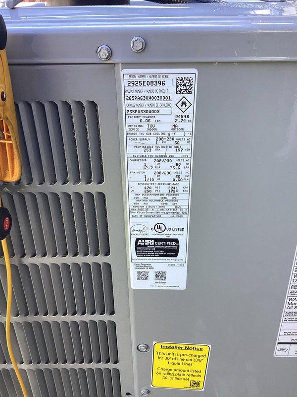 Completed full system installation of Carrier Performance Series 26SPA630W003 single-stage air conditioner with matching CVAVA3617XMA evaporator coil. Removed and recycled existing equipment, installed new 2" PVC condenser pad with pea gravel base, reconnected to existing line set after flushing and pressure testing, and installed new electrical disconnect and whip. Reconnected existing supply and return ductwork, performed system startup and charging procedures, verified proper operation, completed quality assurance walkthrough, explained system operation to homeowner, and registered equipment warranty.