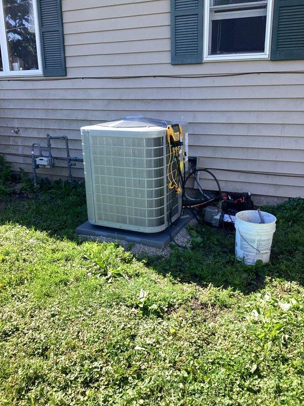 Completed full system installation of Carrier Performance Series 26SPA630W003 single-stage air conditioner with matching CVAVA3617XMA evaporator coil. Removed and recycled existing equipment, installed new 2" PVC condenser pad with pea gravel base, reconnected to existing line set after flushing and pressure testing, and installed new electrical disconnect and whip. Reconnected existing supply and return ductwork, performed system startup and charging procedures, verified proper operation, completed quality assurance walkthrough, explained system operation to homeowner, and registered equipment warranty.