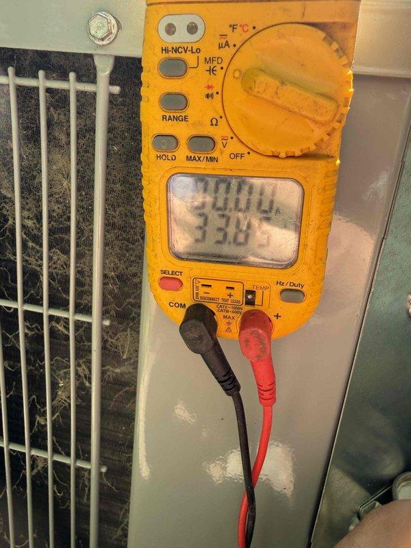 Completed scheduled prepaid cooling system maintenance visit within requested 8-12 AM timeframe. Performed comprehensive system inspection including ductwork evaluation and electrical diagnostics. Measured system voltage at 32.0V using digital multimeter to verify proper electrical operation. Inspected condenser coil condition through protective grille, noting minor dirt accumulation on fins. Examined flexible ductwork and air distribution components, including filter grille and mounting hardware, which showed normal operational wear and dust buildup consistent with regular use. System operating within normal parameters at time of service.