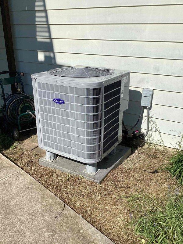 Completed warranty compressor replacement on residential Carrier air conditioning unit. Retrieved warranty compressor from shop, performed changeout, evacuated system, recharged with refrigerant to manufacturer specifications, and verified proper operation with manifold gauges showing 328.8 PSI high side pressure and 122°F discharge temperature.