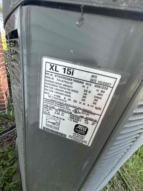 Responded to no cooling complaint on heat pump system. Upon inspection, evaluated existing outdoor XL 15i heat pump unit and indoor furnace system approximately 3 years old. Documented current equipment configuration including ductwork, refrigerant lines, condensate drainage system, and electrical connections. Assessed system performance and identified need for heat pump replacement. Provided comprehensive estimate for replacement of outdoor heat pump unit while retaining existing furnace equipment. Photographed existing installation showing indoor air handler with associated PVC drainage piping, copper refrigerant lines, insulated ductwork, and outdoor condenser unit with specification label for customer records and replacement planning purposes.
