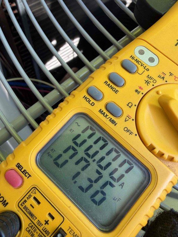 Completed final prepaid cooling system maintenance visit on residential dual air conditioning unit installation. Performed comprehensive system check including electrical diagnostics with multimeter readings showing 20.0V and 654 readings at indoor unit, verified both outdoor condensing units operating within normal parameters, inspected all components through scheduled 07/2026 maintenance agreement expiration.