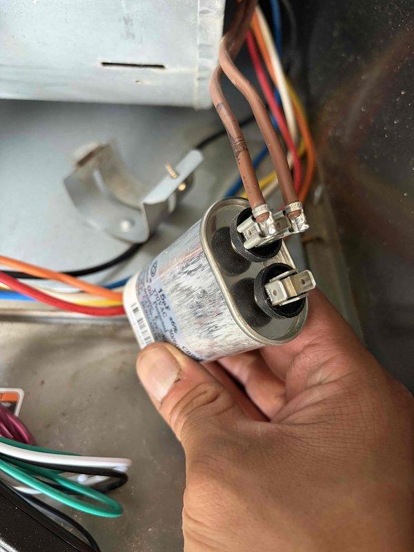 Responded to no cooling complaint following recent maintenance visit. Upon arrival, performed diagnostic testing of system operation. Measured supply air temperature at register reading 90.54°F, confirming inadequate cooling performance. Inspected outdoor condensing unit and identified failed capacitor preventing compressor operation. Removed defective capacitor and installed new replacement unit. Verified proper electrical connections and tested system startup. Confirmed compressor engaged properly and system returned to normal cooling operation with appropriate temperature differential.