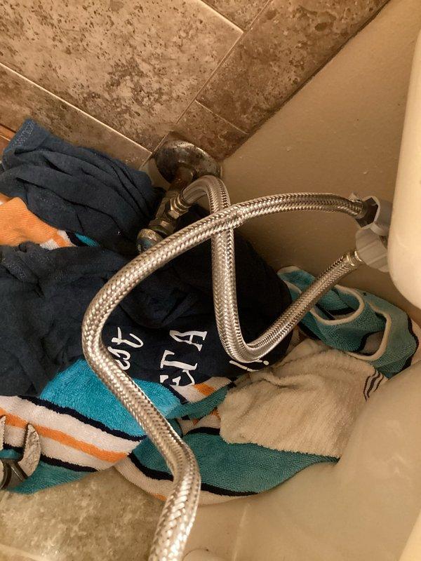 Responded to service call for toilet leaking at bidet fitting connection. Upon arrival, inspected water supply lines and shut-off valve assembly in bathroom corner where leak was reported. Replaced worn braided metal supply hoses that showed signs of age and deterioration at connection points. Tightened all fittings at bidet attachment point and verified proper seal at shut-off valve to eliminate external leakage. Tested system for leaks and confirmed repair successful with no visible water discharge outside toilet area.
