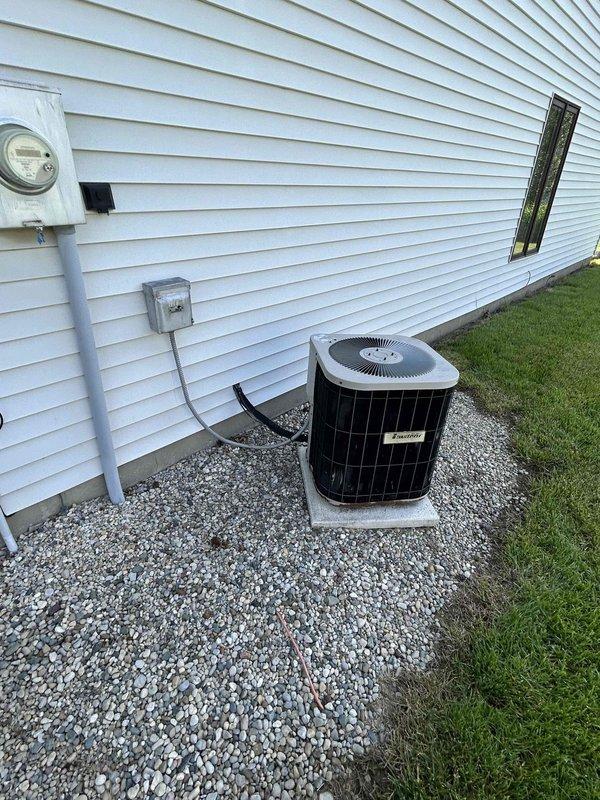 Conducted comprehensive assessment of existing HVAC system and water heater at rental property to provide replacement estimate. Evaluated outdoor air conditioning unit, indoor furnace system with associated ductwork and refrigerant lines, and tanked water heater installation. Documented current equipment conditions including AC condenser placement on gravel pad with electrical disconnect, supply ductwork with insulated refrigerant lines, and PVC venting configuration. Customer requested time to consider project scope and indicated they would schedule installation at a later date due to other ongoing projects.