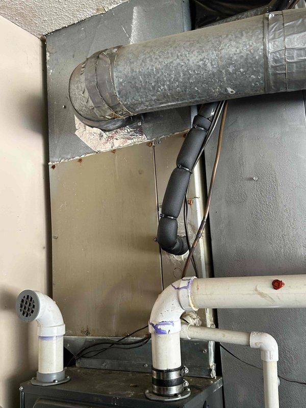 Conducted comprehensive assessment of existing HVAC system and water heater at rental property to provide replacement estimate. Evaluated outdoor air conditioning unit, indoor furnace system with associated ductwork and refrigerant lines, and tanked water heater installation. Documented current equipment conditions including AC condenser placement on gravel pad with electrical disconnect, supply ductwork with insulated refrigerant lines, and PVC venting configuration. Customer requested time to consider project scope and indicated they would schedule installation at a later date due to other ongoing projects.