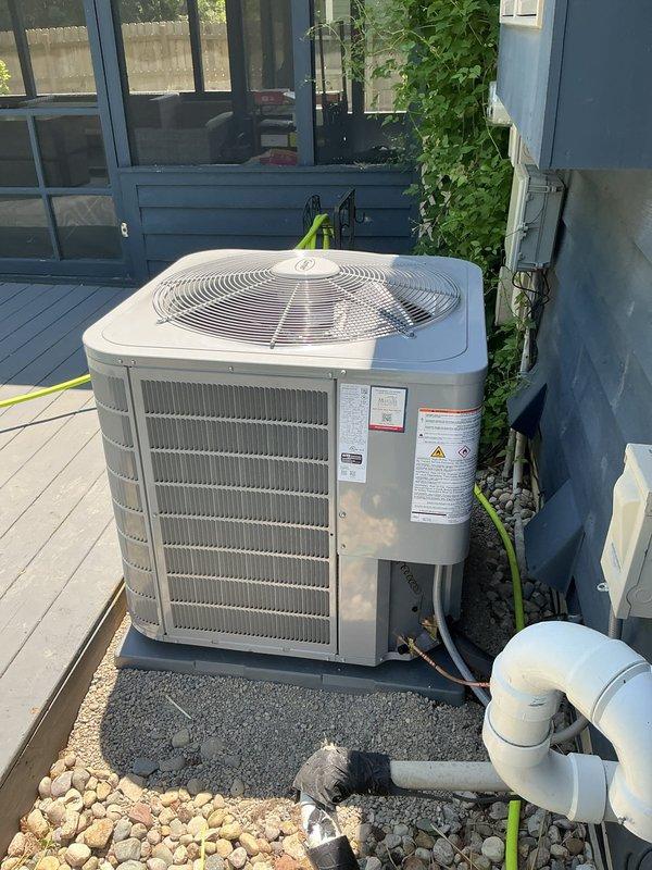 Successfully installed Carrier Performance Series two-stage air conditioner (Model 26TPA848W003) and Carrier evaporator coil (Model CVAVA4821XMA) at residential property. Outdoor condenser unit positioned on new 2" PVC pad with pea gravel base on wooden deck area, with electrical disconnect and whip installed per code requirements. Indoor evaporator coil integrated with existing furnace system in basement mechanical room. Reconnected to existing line set after flushing and pressure testing to verify system integrity. Removed and recycled old equipment, implemented floor protection during installation, and thoroughly cleaned work areas. Conducted comprehensive system startup, verified proper refrigerant charge, airflow, and operational parameters across both cooling stages. Completed post-installation quality assurance inspection, explained system operation and controls to homeowner, and registered manufacturer warranties for both units.