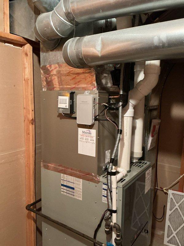 Successfully installed Carrier Performance Series two-stage air conditioner (Model 26TPA848W003) and Carrier evaporator coil (Model CVAVA4821XMA) at residential property. Outdoor condenser unit positioned on new 2" PVC pad with pea gravel base on wooden deck area, with electrical disconnect and whip installed per code requirements. Indoor evaporator coil integrated with existing furnace system in basement mechanical room. Reconnected to existing line set after flushing and pressure testing to verify system integrity. Removed and recycled old equipment, implemented floor protection during installation, and thoroughly cleaned work areas. Conducted comprehensive system startup, verified proper refrigerant charge, airflow, and operational parameters across both cooling stages. Completed post-installation quality assurance inspection, explained system operation and controls to homeowner, and registered manufacturer warranties for both units.