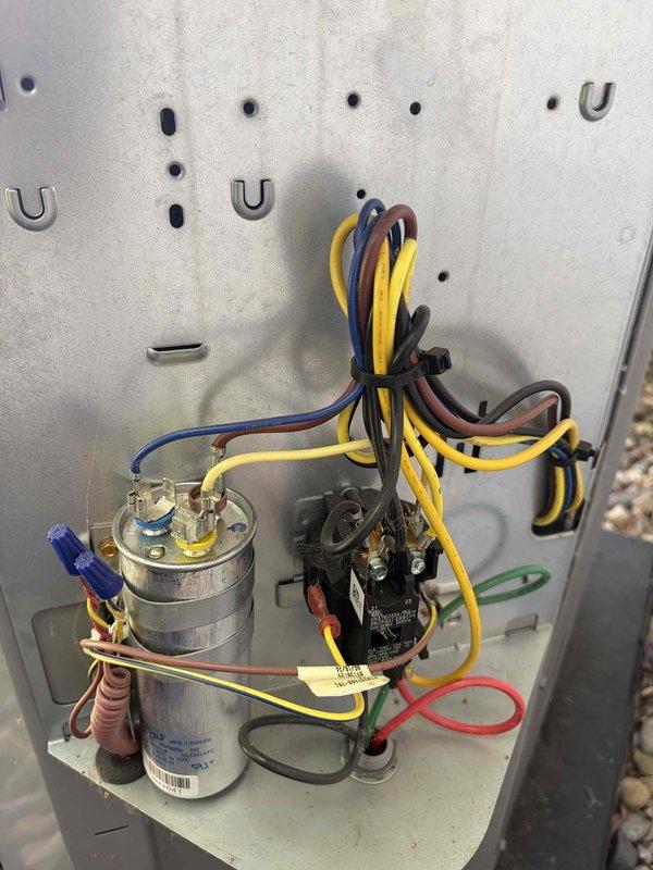 Performed preventative maintenance and tune-up on residential HVAC system less than one year old. Conducted comprehensive inspection of outdoor condensing unit, including electrical control panel examination. Verified proper operation of capacitor and contactor assembly, inspected all electrical connections and wire terminations for security and proper torque. Utilized digital multimeter to test electrical components and verify system voltage and amperage readings within manufacturer specifications. All components found to be functioning properly with no deficiencies noted. System operating as designed with no cooling issues present.