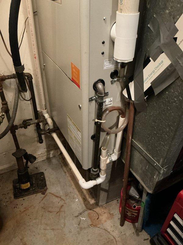 Conducted on-site assessment for complete HVAC system replacement including outdoor air conditioning condenser unit and indoor furnace. Evaluated existing equipment condition, documented current installation configuration with exterior condenser mounted on concrete pad and indoor cabinet-style furnace with associated refrigerant lines, PVC condensate drainage, and venting systems. Provided comprehensive replacement estimate for both heating and cooling equipment to customer who selected equipment options for system upgrade.