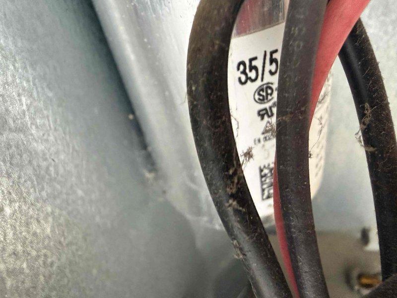Completed comprehensive air conditioning tune-up on residential cooling system. Performed standard preventive maintenance procedures including inspection of outdoor condenser unit, verification of electrical connections and wire specifications, and assessment of refrigerant lines showing minor surface corrosion. Unit operational and system functioning within normal parameters at time of service completion.