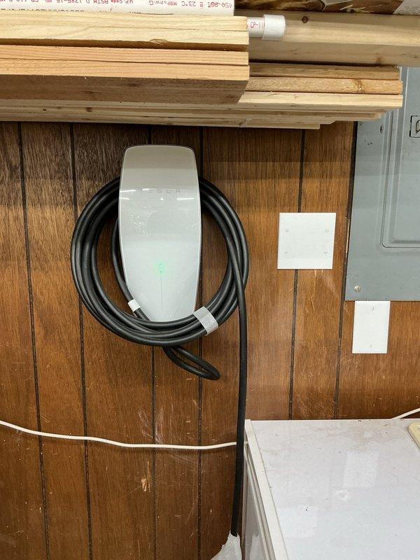 Installed a dedicated 60-amp, 240-volt circuit for Tesla EV charger located to the left of the main electrical panel using 6/3 Romex wiring, QO260 double-pole breaker, and QO panel modifications. Additionally, installed two GFCI-protected outdoor receptacles on the rear exterior wall behind the panel near the deck area, utilizing weather-resistant PVC outlet boxes with in-use covers, 12/2 Romex, appropriate conduit and strapping, and proper grounding per NEC requirements.