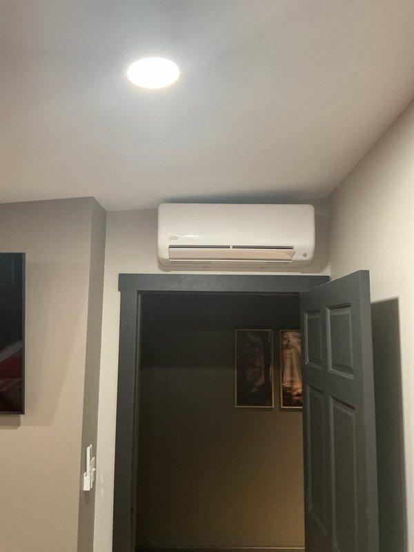 Installed a Carrier multizone ductless mini split heat pump system consisting of one 37MGHAQ30EA3 30,000 BTU outdoor unit with R454 refrigerant mounted on roof with PVC pad and risers, one 45MAHAQ18XX3 18,000 BTU high wall head in main area, and one 45MAHAQ09XX3 9,000 BTU high wall head in master bedroom. Ran linesets, control wiring, and condensation drain lines to mechanical room, performed system startup and testing to verify proper operation of both zones.
