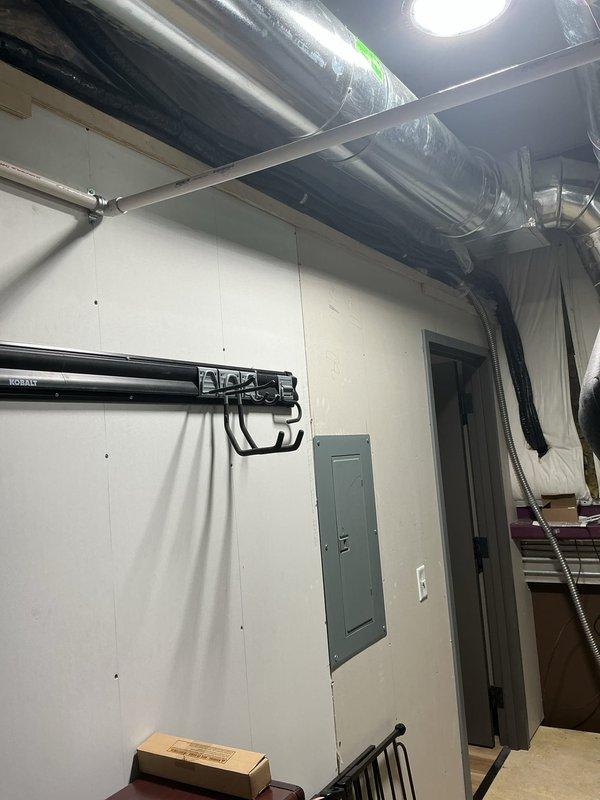 Installed a Carrier multizone ductless mini split heat pump system consisting of one 37MGHAQ30EA3 30,000 BTU outdoor unit with R454 refrigerant mounted on roof with PVC pad and risers, one 45MAHAQ18XX3 18,000 BTU high wall head in main area, and one 45MAHAQ09XX3 9,000 BTU high wall head in master bedroom. Ran linesets, control wiring, and condensation drain lines to mechanical room, performed system startup and testing to verify proper operation of both zones.