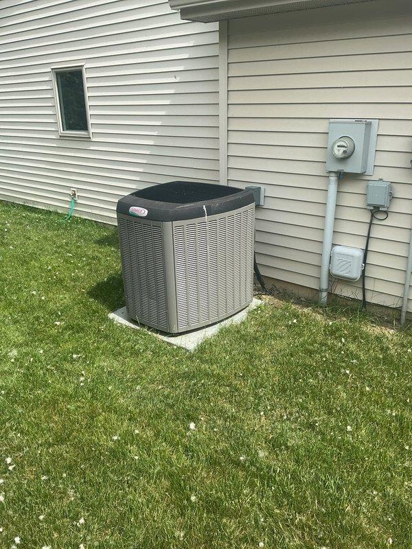 Conducted comprehensive estimate for complete HVAC system replacement at residential property. Evaluated existing gas furnace located in garage and assessed current air conditioning unit experiencing operational issues. Inspected outdoor condensing unit positioned on concrete pad near electrical meter and disconnect box, documented existing ductwork configuration including foil-faced insulated components and rectangular supply connections, and measured system dimensions to provide accurate equipment sizing recommendations for replacement furnace and air conditioning system.
