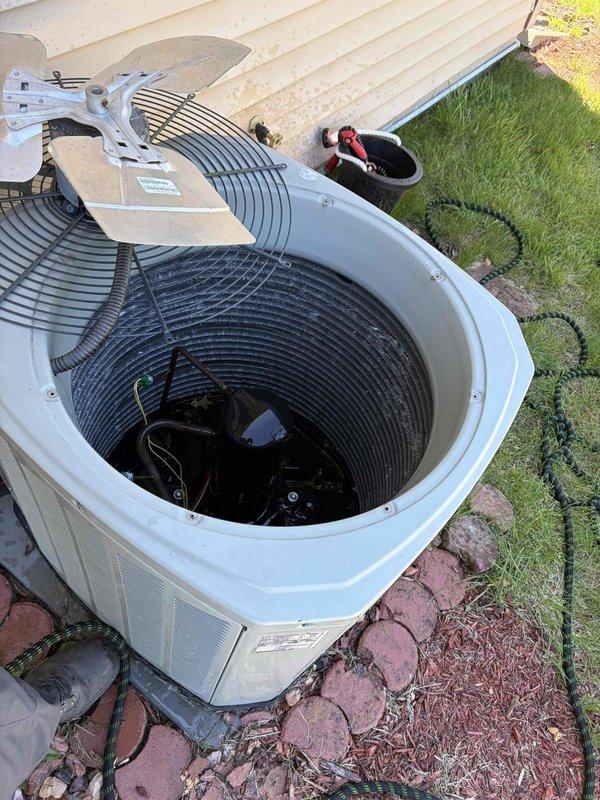 Performed comprehensive air conditioning tune-up on outdoor condensing unit, including system diagnostics and electrical testing using digital multimeter to verify proper voltage and capacitance readings. Inspected condenser coil, fan motor operation, and refrigerant pressures to ensure optimal cooling performance. All components found operating within manufacturer specifications; system ready for seasonal operation.
