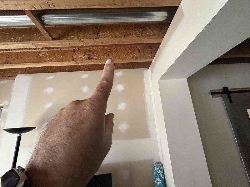 Conducted comprehensive HVAC system evaluation for equipment replacement estimate. Assessed existing exterior condensing unit and interior ductwork infrastructure, documenting current system configuration including refrigerant line routing, electrical connections, and structural considerations. Evaluated ceiling-mounted distribution system with exposed ductwork and identified wall-mounted service disconnects and drainage components for replacement planning purposes.