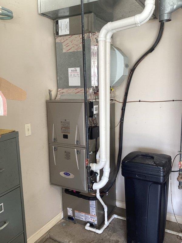 Completed full HVAC system replacement installing Carrier Performance Series two-stage air conditioner model 26TPA824W003, Carrier Infinity Series 98% AFUE communicating modulating gas furnace model 59MN7C060C17-14, evaporator coil model CVAEVA3017XMA, and Infinity System Controller WiFi thermostat model SYSTXCCITC01-C. Removed and recycled existing equipment, reconnected supply and return ductwork to new system, installed new electrical disconnect and whip for outdoor unit. Verified proper refrigerant pressures and system operation using digital manifold gauges, confirmed furnace combustion efficiency and gas valve modulation, programmed communicating thermostat for optimal system performance. Registered all equipment warranties with manufacturer, provided thermostat operation training, and completed post-installation quality assurance walkthrough with senior technician confirming all components functioning within manufacturer specifications.